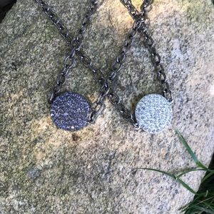 Crystal disc necklace with gunmetal chain.